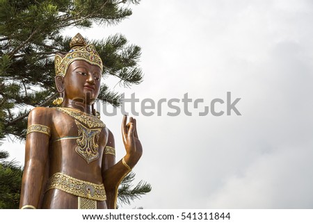 Big beautiful brown wooden Buddha. Located a top a hill in Wat Phra That Doi Suthep.Chiangmai, Thailand 