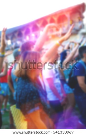 People having fun at music festivala. The blur effect.
