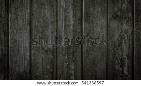 Old rural wooden wall in dark and black colors, detailed plank photo texture. Natural wooden building structure background.
