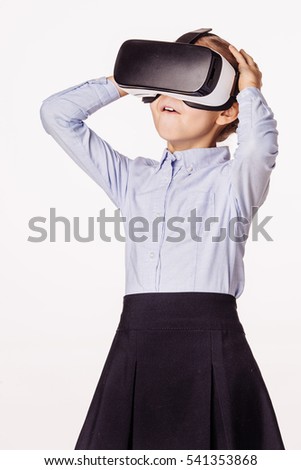 little schoolgirl with virtual reality headset. Innovation technology and education concept