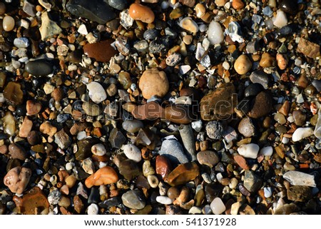 Background picture of wet rocks and pebbles at Southend