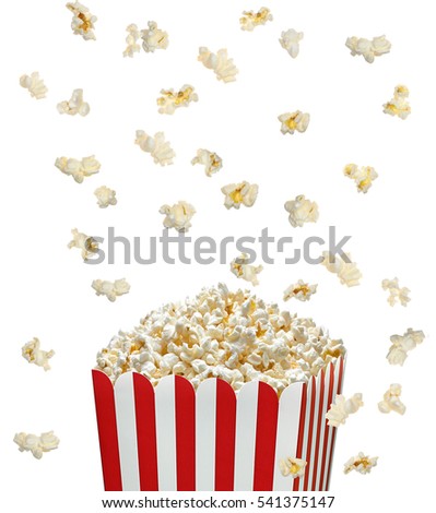 Popcorn falling in striped bucket on white background 