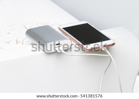 Smartphone and powerbank. Is a symbol of mobile energy and electric equipment in modern design