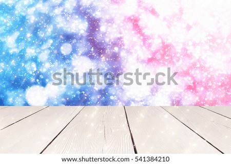 White Table and Christmas abstract blue with red sun background with light and glitter bokeh