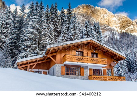 Beautiful luxury chalet in French Alps in the winter. Royalty-Free Stock Photo #541400212