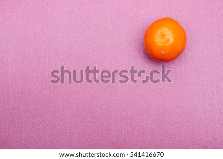 Colorful Food life concept. Color riot food photography. Orange mandarin color background. Closeup. Top view.