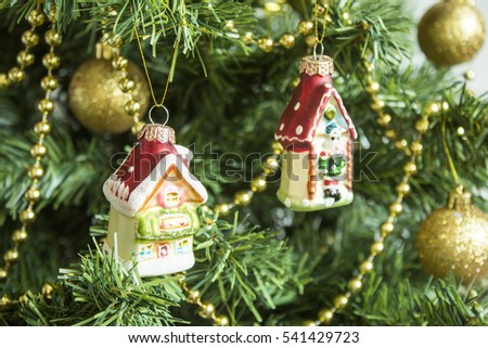 Christmas tree with decorations toy house, holiday new year background.