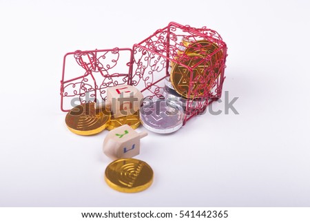 Image of jewish holiday Hanukka with red dreidel and chocolate coins on white background