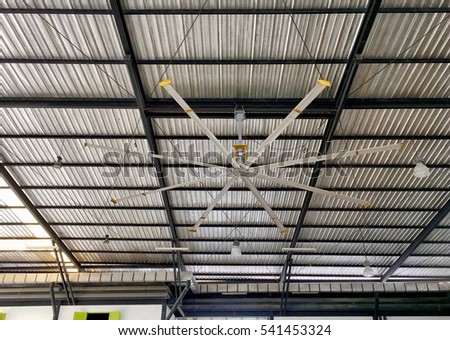 Giant fan hangs on the ceiling Royalty-Free Stock Photo #541453324