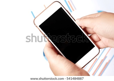 Business concept with documents and mobile phone. Financial accounting stock market graphs analysis