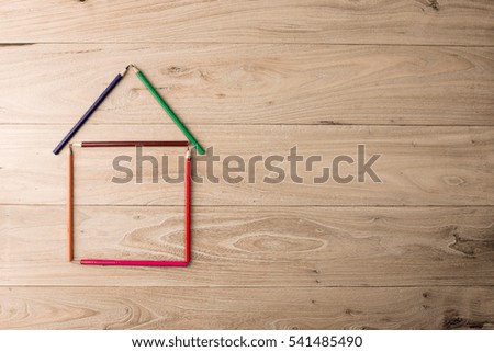 Colorful pencils in the wood