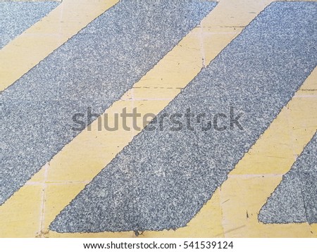 Texture of  road with yellow traffic sign used for background