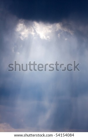 The big powerful storm clouds with sunlight