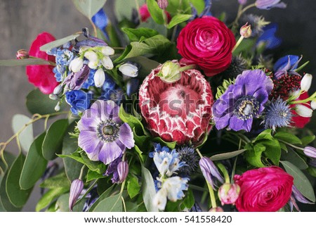 red bouquet. multicolor bouquet. purple flowers. ranunculus  