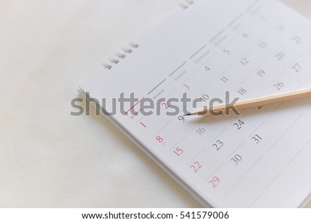 Blurred calendar page in over white tone. Royalty-Free Stock Photo #541579006
