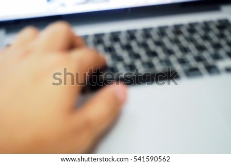 Picture blurred  for background abstract and can be illustration to article of hand on keyboard close up
