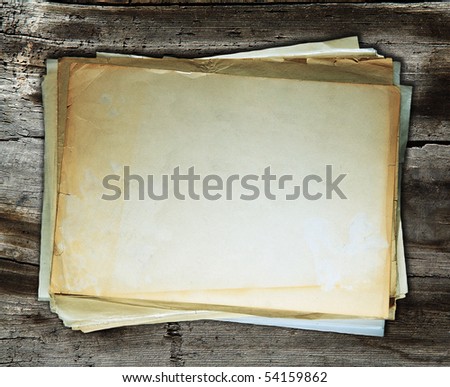 stack of old papers on wooden background