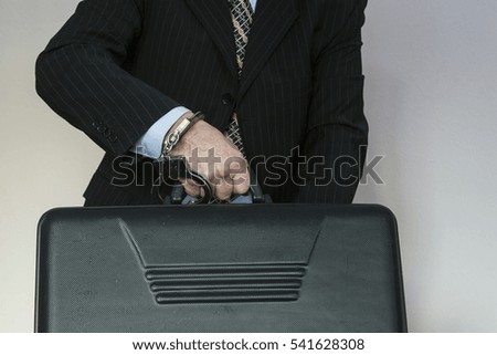 Case chained to hand handcuffs
