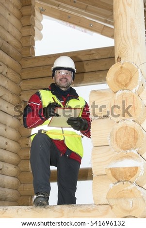 Engineer - builder on a building site.