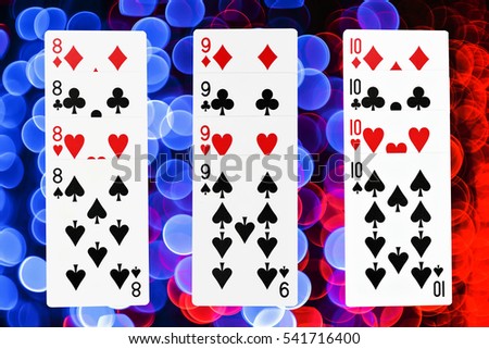 Poker card game with 8, 9, 10,  on bokeh background 