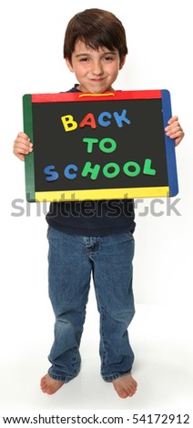 adorable seven year old boy holding back to school magnetic chalk board
