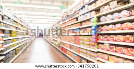 Blurred selection of pasta, ketchup, condiment, tomato sauce and canned vegetable on shelves in store at Humble, Texas, US. Aisle, row variety product, defocused background, bokeh light. Panorama view Royalty-Free Stock Photo #541750201