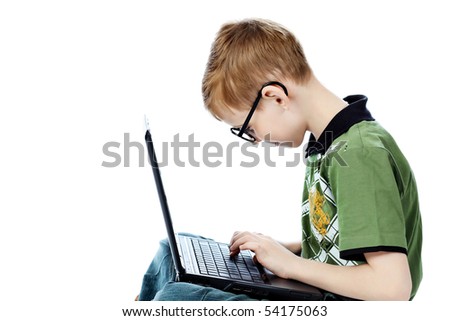 Shot of a boy sitting with his laptop. Isolated over white background.