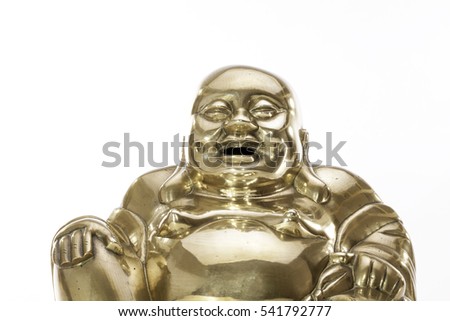 Traditional Brass Buddha figure against white background. The laughing monk brass figure with happy smiling expression.