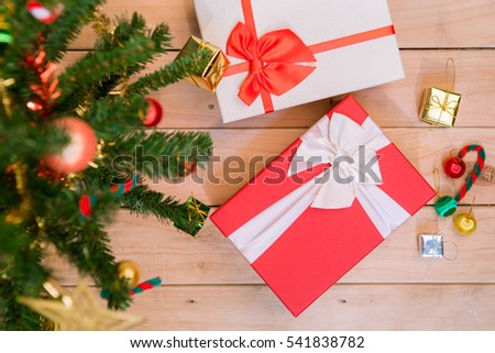 Beautiful Decorated Christmas tree with gifts on wood background. soft focus 