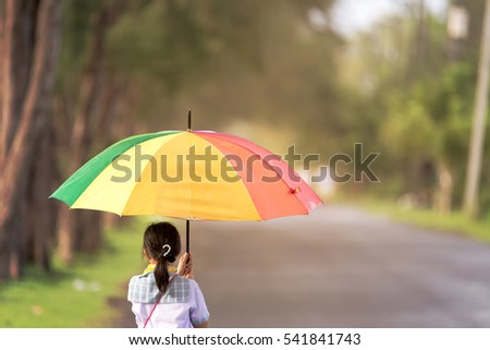 My daughter with indoor pool in the rainy days.Girl walking in the Park