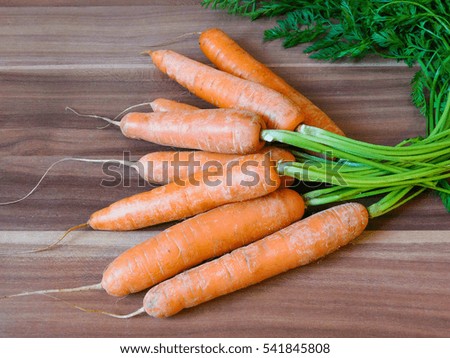 fresh carrot on wood background,temperature