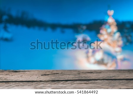 Wooden boards on the background of the Christmas tree evening