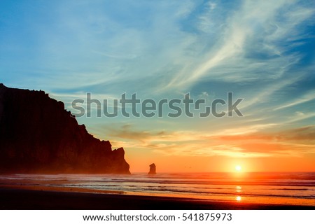 HDR image of a beautiful sunset at Morro bay, San Luis Obispo County California Royalty-Free Stock Photo #541875973
