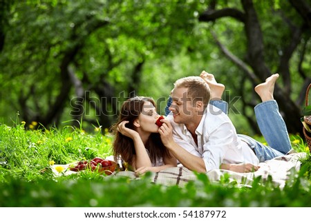 Young enamoured couple on picnic in wood Royalty-Free Stock Photo #54187972