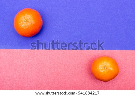 Colorful Food life concept. Color riot food photography. Orange mandarin color background. Closeup. Top view.