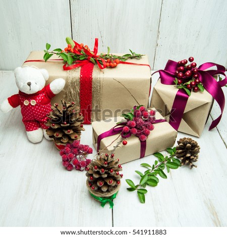 bright holiday gifts: boxes, toys, cones, ribbons on a white background