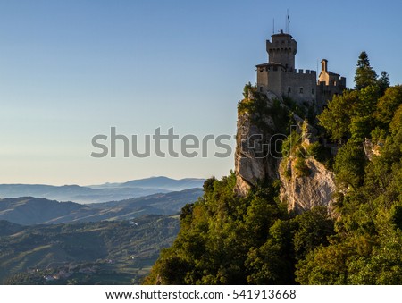 Beautiful view of the medieval fortress Cesta overlooking the green hills of San Marino republic.