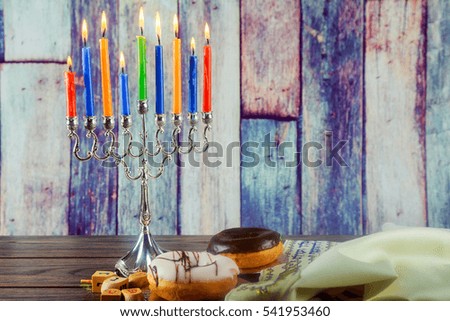 Jewish holiday Image of jewish holiday Hanukkah background with menorah traditional candelabra and burning candles