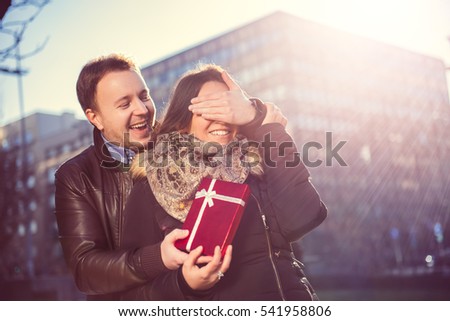 Man Surprises woman With a Gift in the city