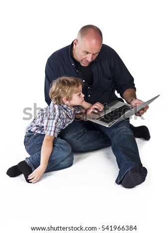 Father and son working on the laptop computer together isolated on white background