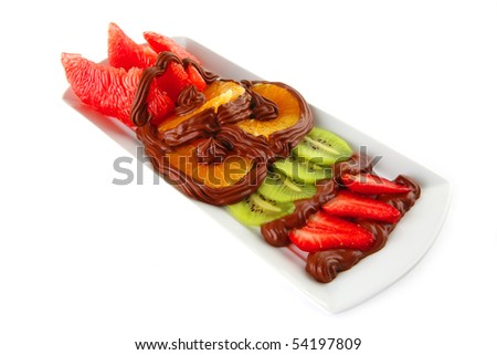 exotic fruits in cream on white plate