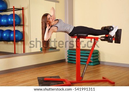 Girl doing exercises for abdominal muscles. Healthy lifestyle concept. Fitness.