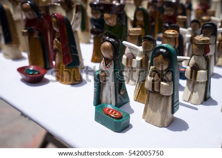 small wooden statues closeup in the otavalo market in Ecuador