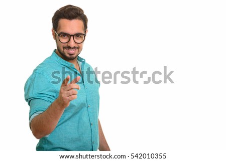 Young happy Indian man pointing finger at camera isolated against white background