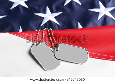 Army tokens on American national flag background