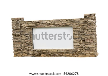 blank housing development entrance sign surrounded by stacked stone