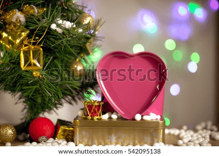 Gift boxes and ornaments in Merry Christmas and Happy New Year concept  with bokeh background, can be use for make a greeting cards.