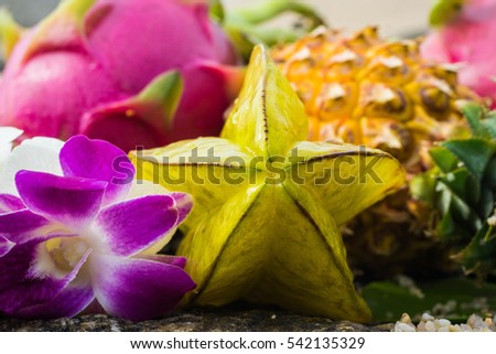 exotic tropical fruits on the stone near the sea