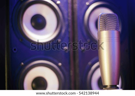 Condenser microphone in a studio. Neon lights