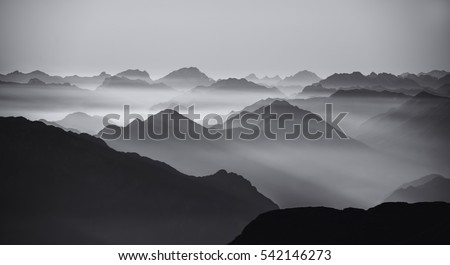 Mountain silhouettes Royalty-Free Stock Photo #542146273